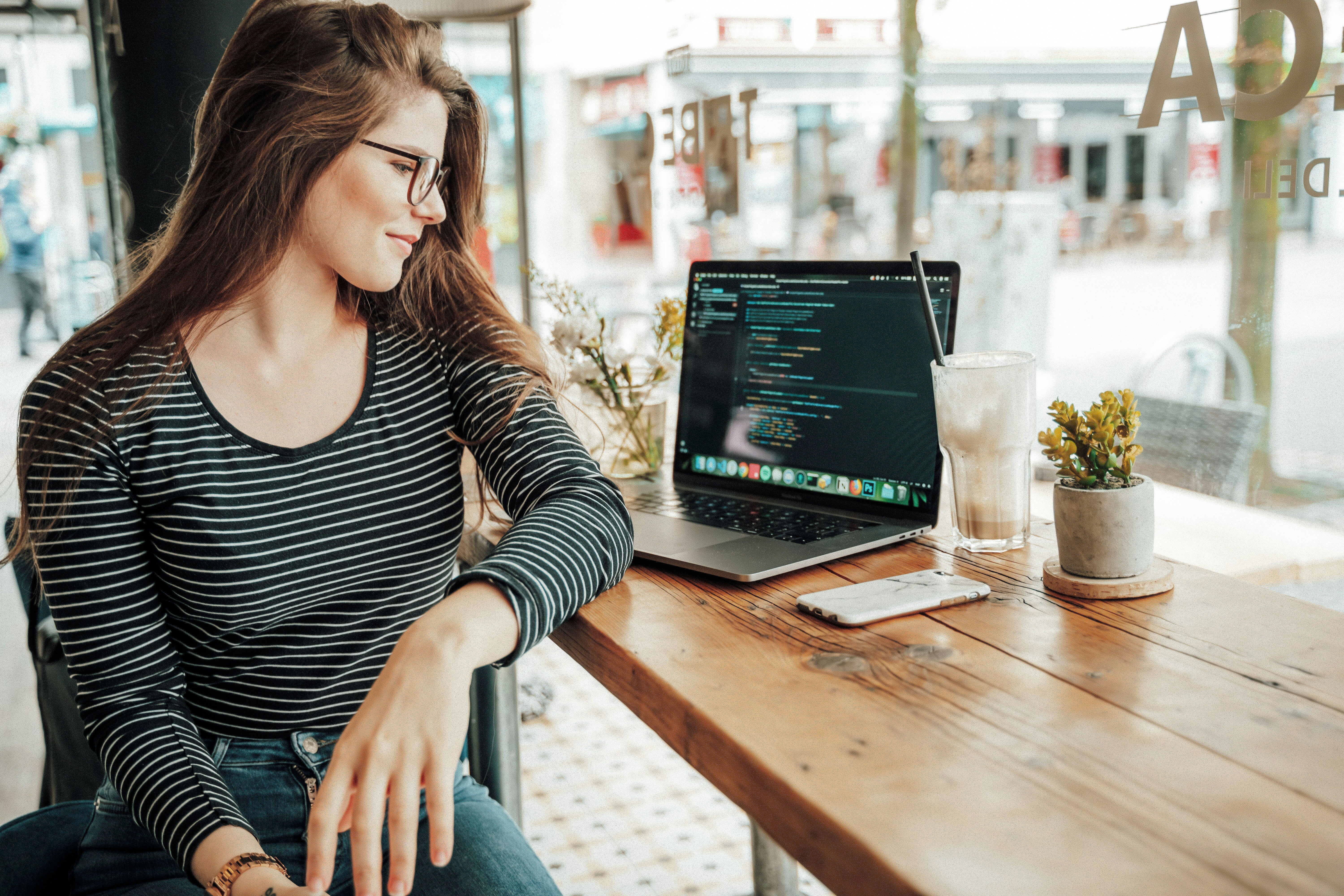 woman infront of laptop - Clinic.Js