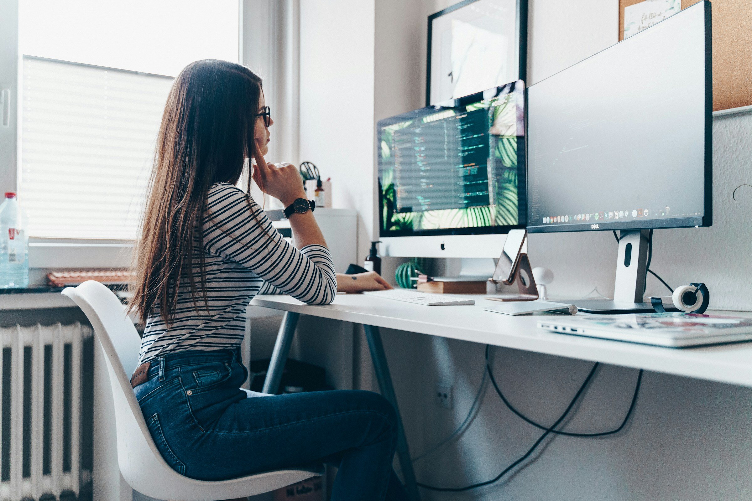 woman sitting infront of computer - Node Observability