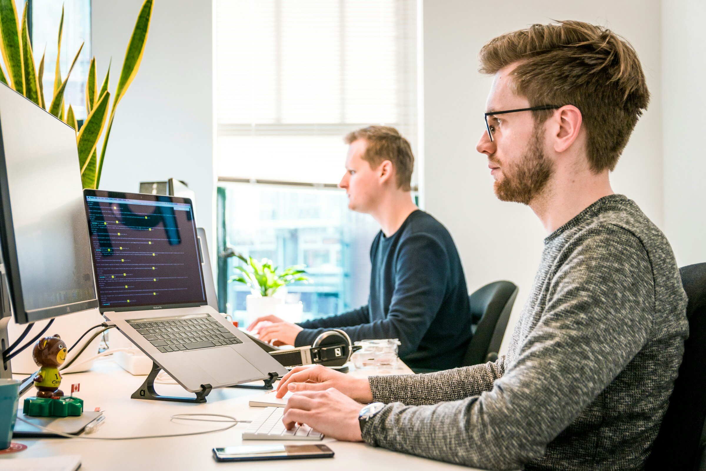 man working on laptop - Front End Metrics