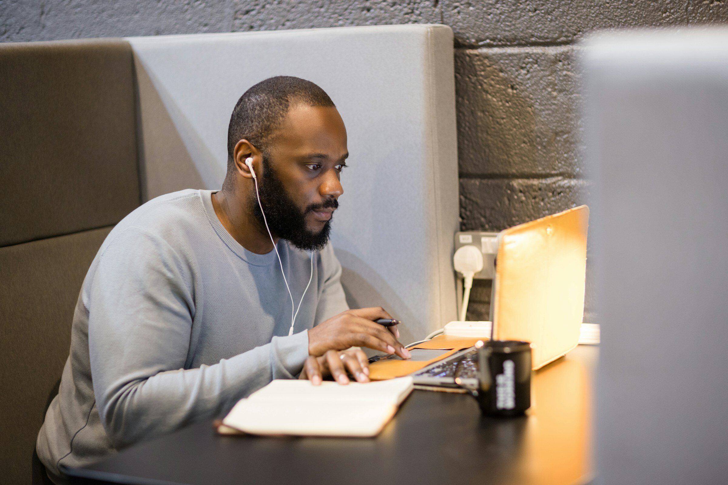 man infront of a computer - Front End Performance Testing