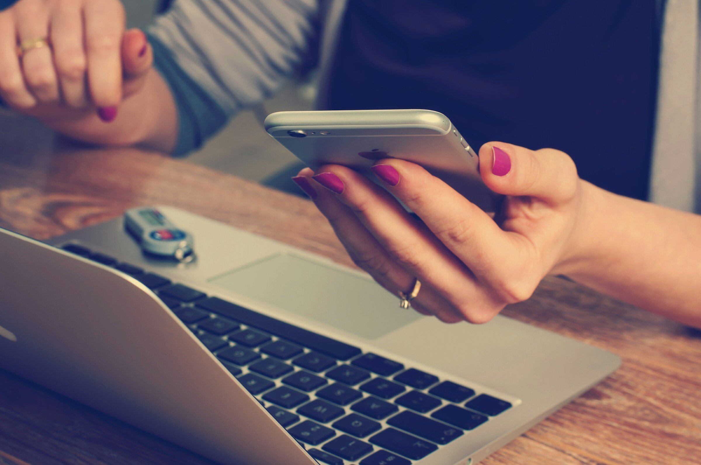 person looking at her mobile - Why Monitoring Your Application Is Important