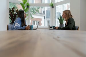 woman in meeting with a friend - End User Monitoring