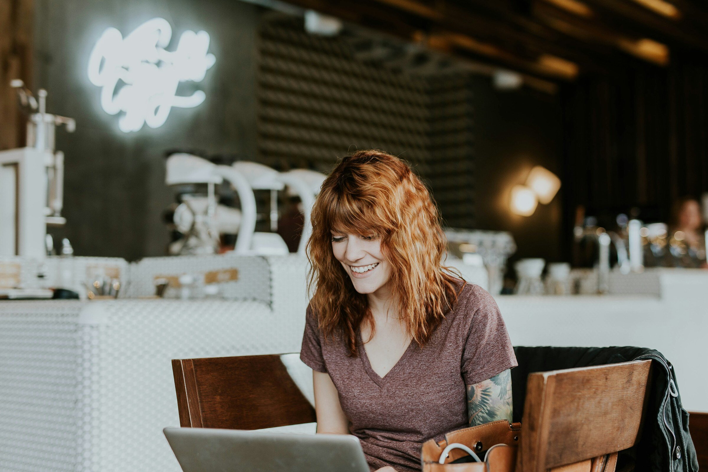 person sitting in bar - Newrelic Pricing