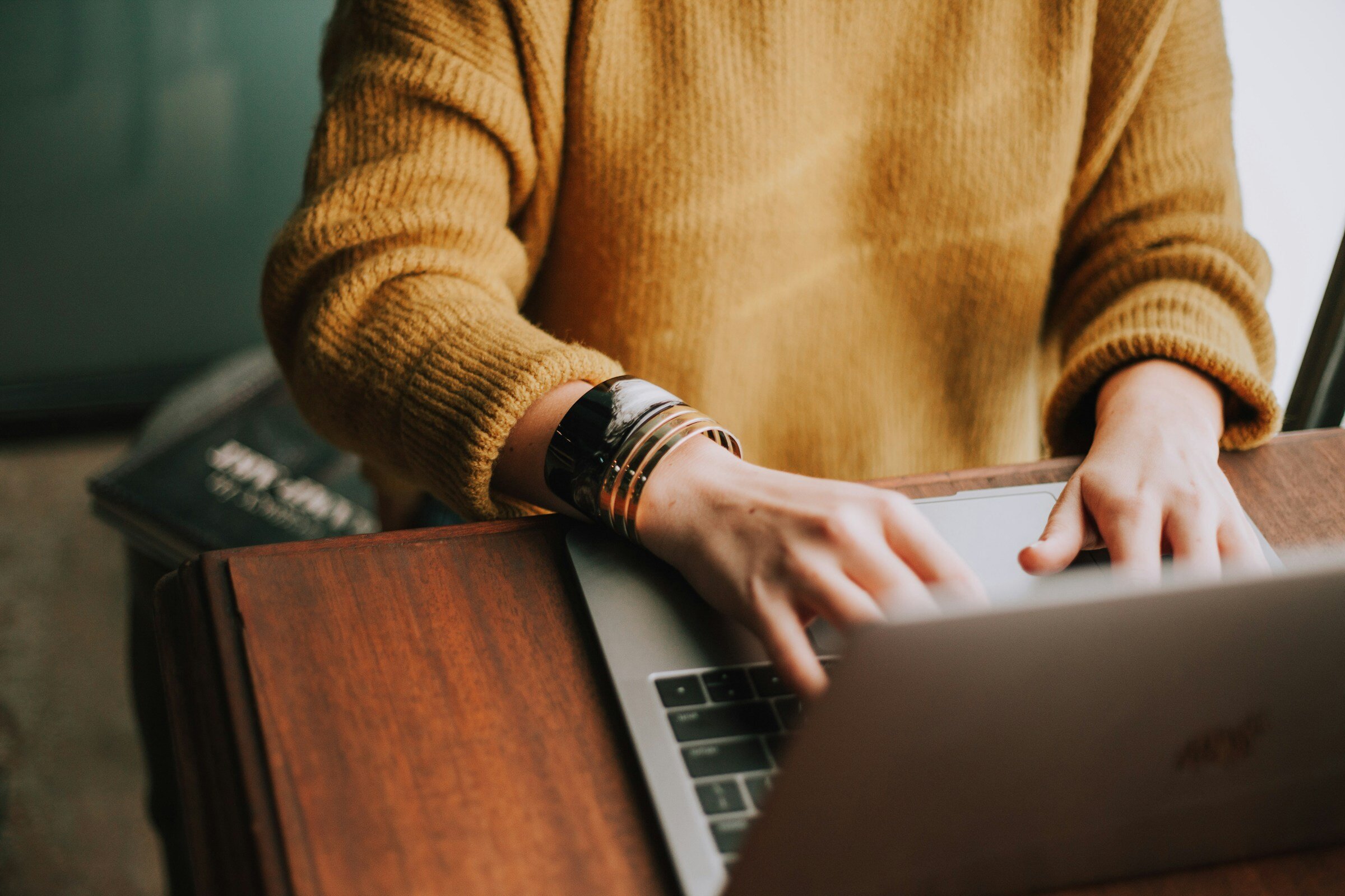 person typing on laptop - Browser Monitoring