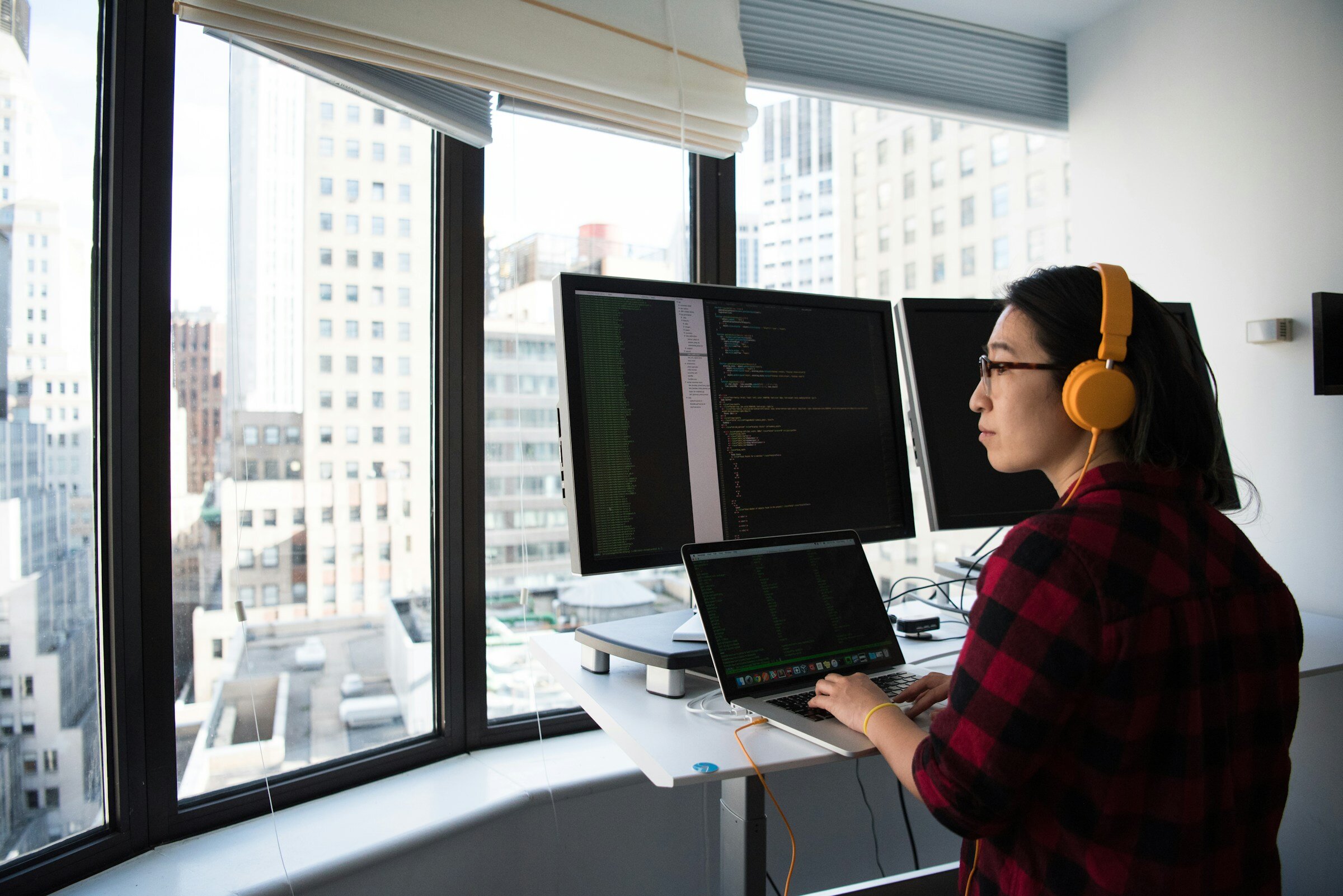 Woman Using Laptop - Kubernetes Application Monitoring