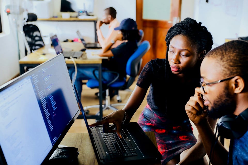 woman teaching junior about Application Security Monitoring