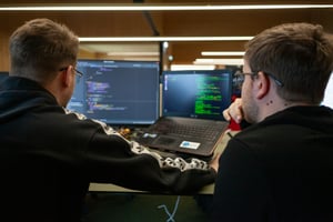 team working on a server - Logicmonitor Alternatives