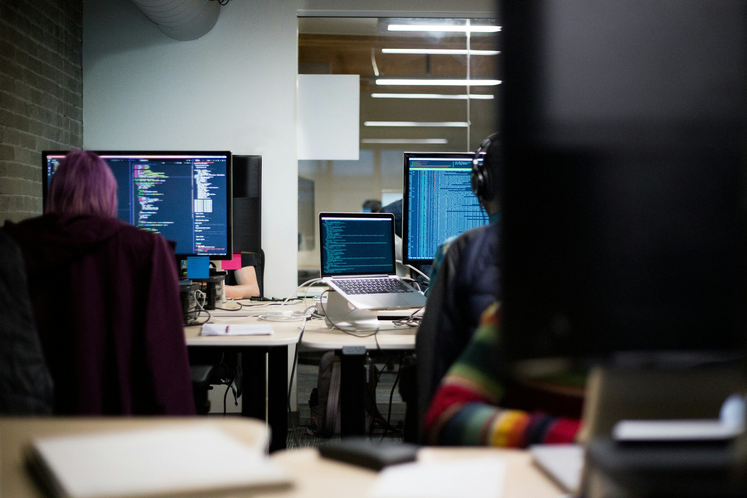 person coding and working - End User Experience Monitoring Tools