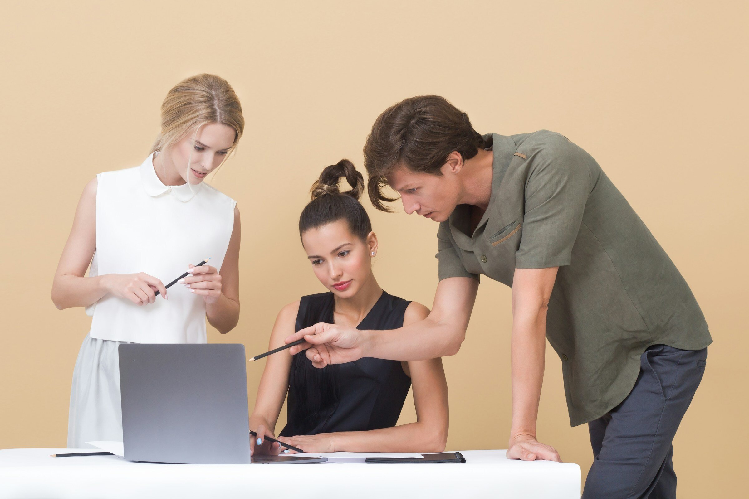 Man Pointing on Laptop for Colleagues - Prometheus Alternatives