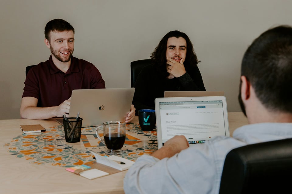 person on desk working with Web App Monitoring