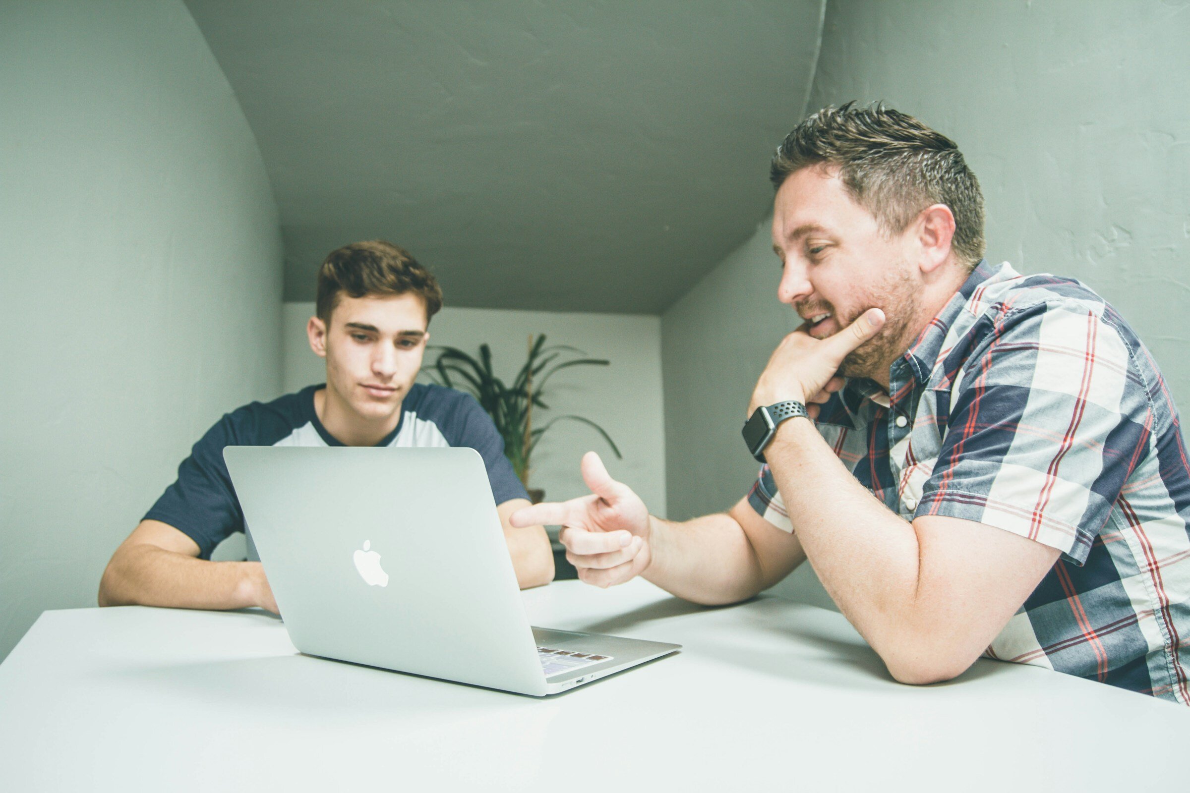 Person Pointing at Laptop - Pingdom Alternatives