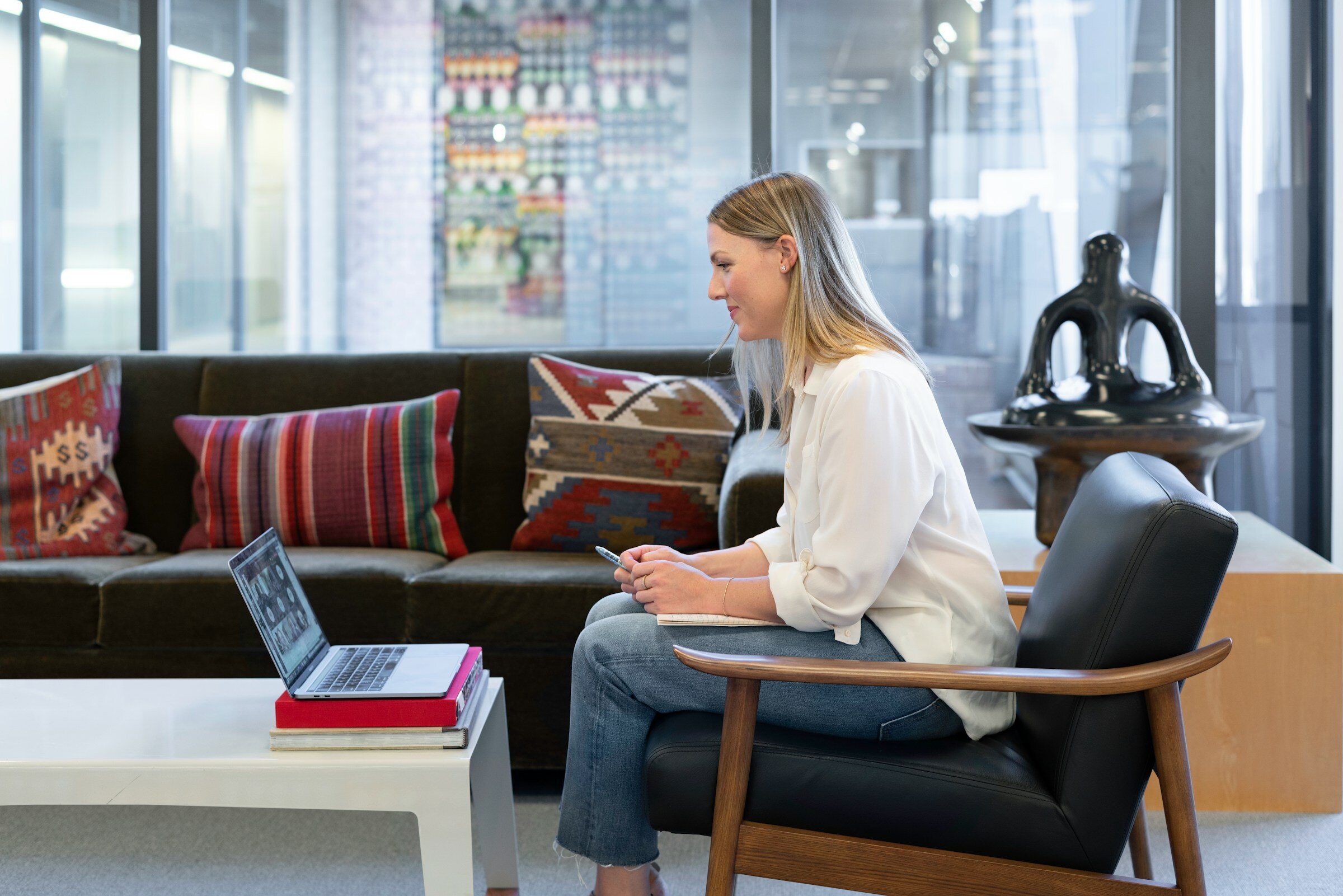 Woman Looking at Laptop - Kubernetes Application Monitoring