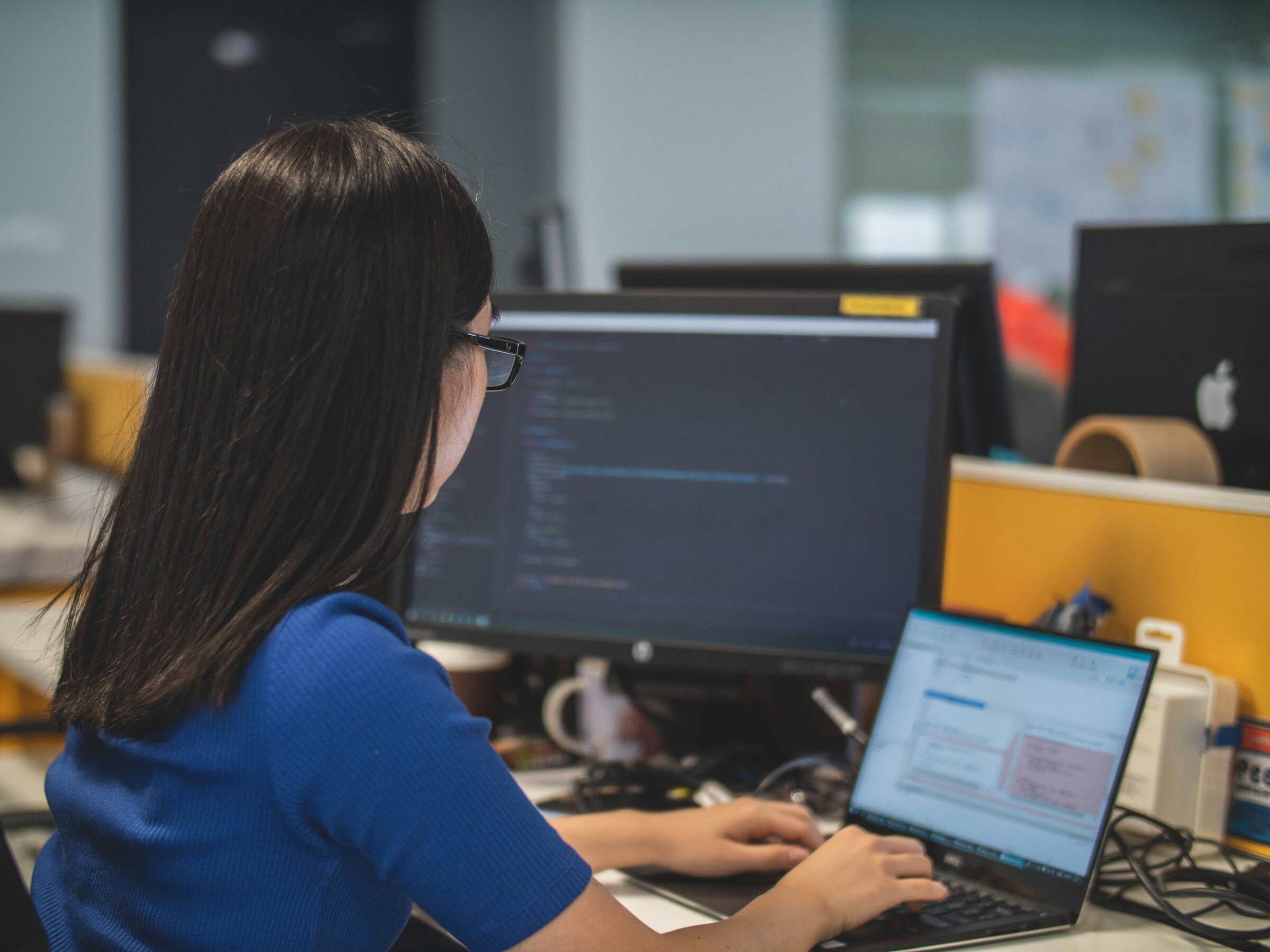 Woman Using Laptop - Frontend Monitoring