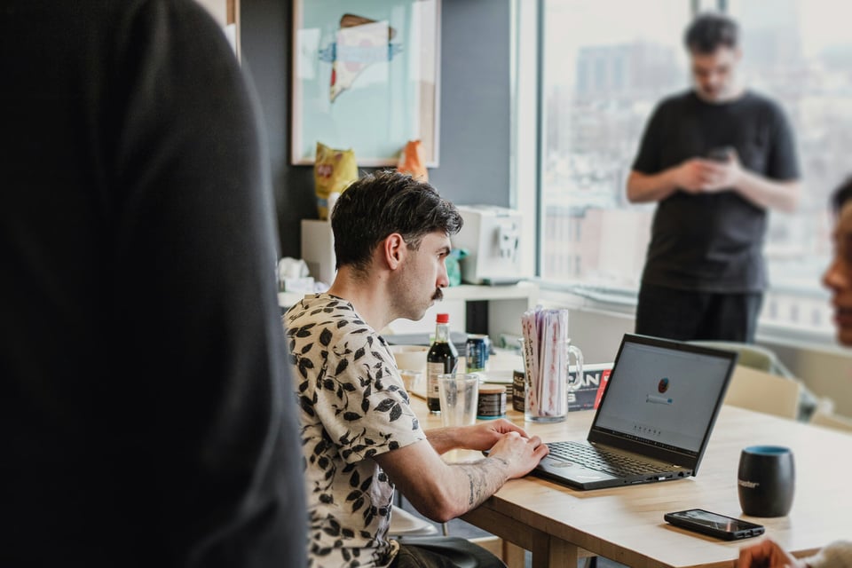 People Sitting in an Office - Observability vs Monitoring