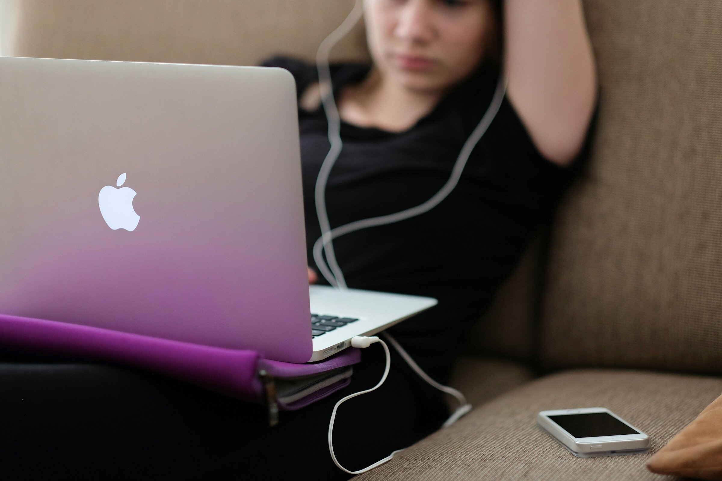 Girl Using Laptop while Laying - Solarwinds Alternatives