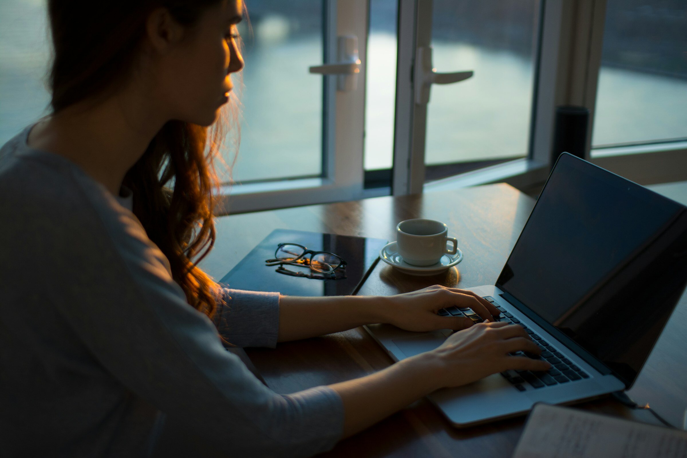 Woman Using Laptop - Dynatrace Pricing