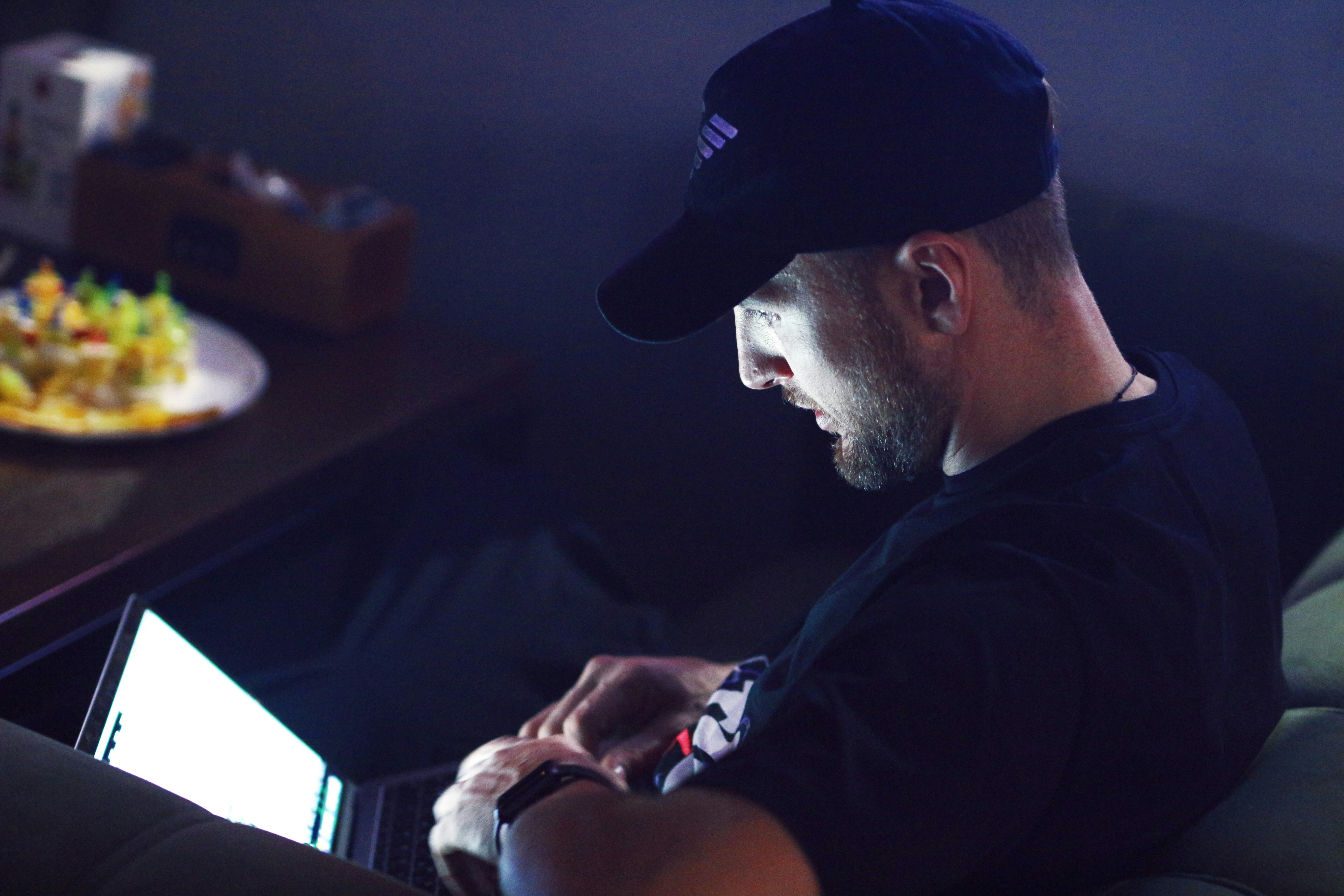 man with his laptop working on Web App Monitoring