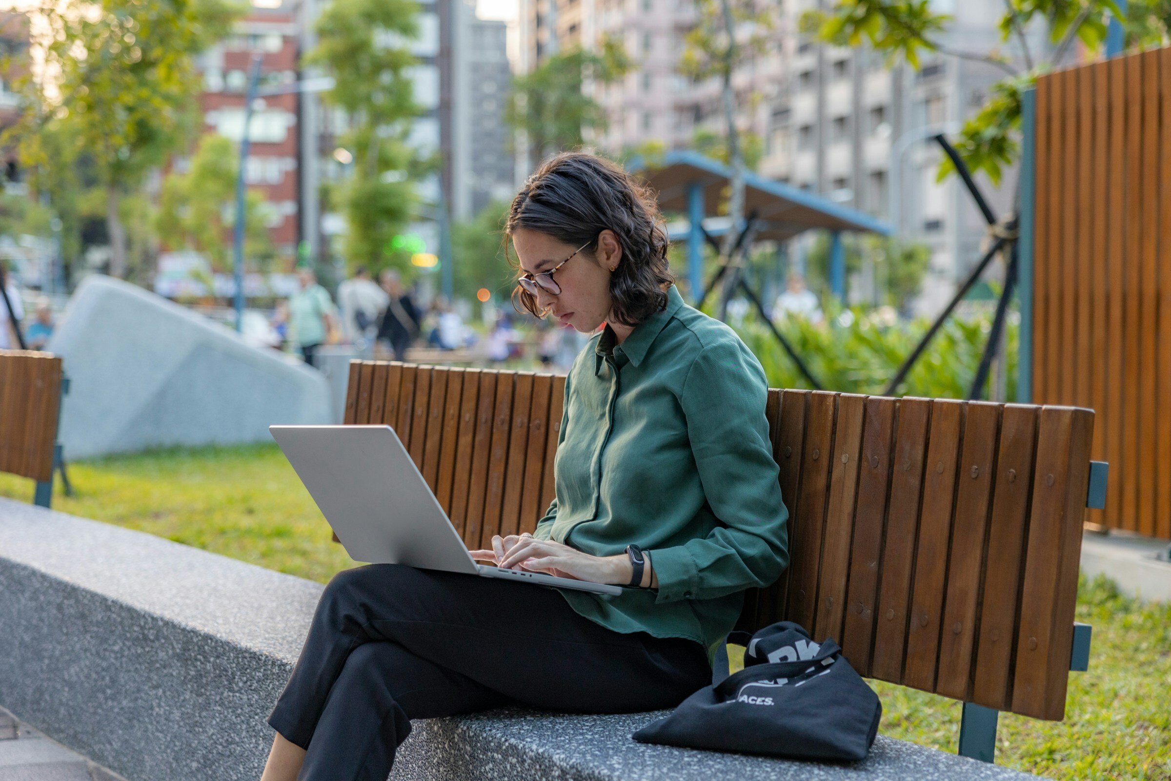 person sitting alone on bench - Datadog Alternatives