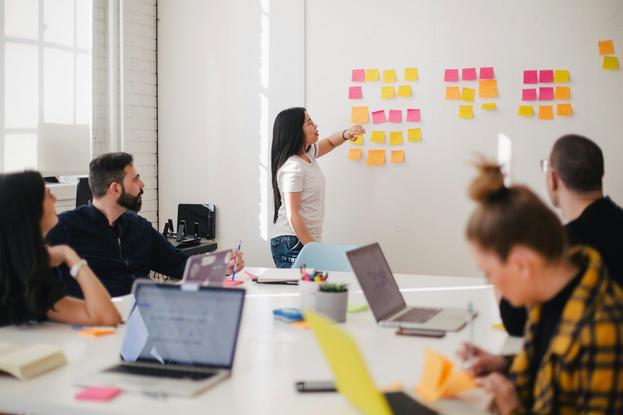 Woman Leading an Office Meeting - Solarwinds Alternatives